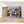 Première image de la peinture par numéro, Bouquet Mauve , dans un cadre en bois sur du parquet.