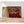 Première image de la peinture par numéro, Chouette Frileuse , dans un cadre en bois sur du parquet.