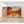 Première image de la peinture par numéro, Coucher de Soleil sur le Nil , dans un cadre en bois sur du parquet.