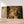 Première image de la peinture par numéro, Regard de Léopard , dans un cadre en bois sur du parquet.