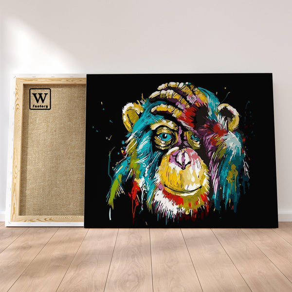Première image de la peinture par numéro, Chimpanzé Coloré , dans un cadre en bois sur du parquet.