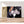 Charger l&#39;image dans la galerie, Première image de la peinture par numéro, Amour d&#39;Enfants , dans un cadre en bois sur du parquet.
