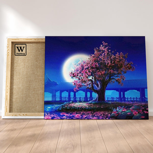 Première image de la peinture par numéro, Cerisier et pleine Lune , dans un cadre en bois sur du parquet.