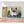 Première image de la peinture par numéro, Chaton dans les Fleurs , dans un cadre en bois sur du parquet.