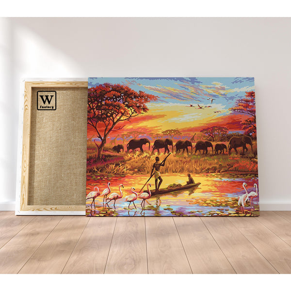 Première image de la peinture par numéro, Coucher de Soleil sur le Nil , dans un cadre en bois sur du parquet.