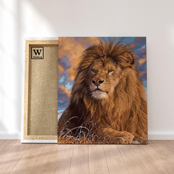 Première image de la peinture par numéro, Lion Majestueux , dans un cadre en bois sur du parquet.