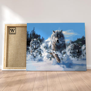 Première image de la peinture par numéro, Loups en Meute , dans un cadre en bois sur du parquet.