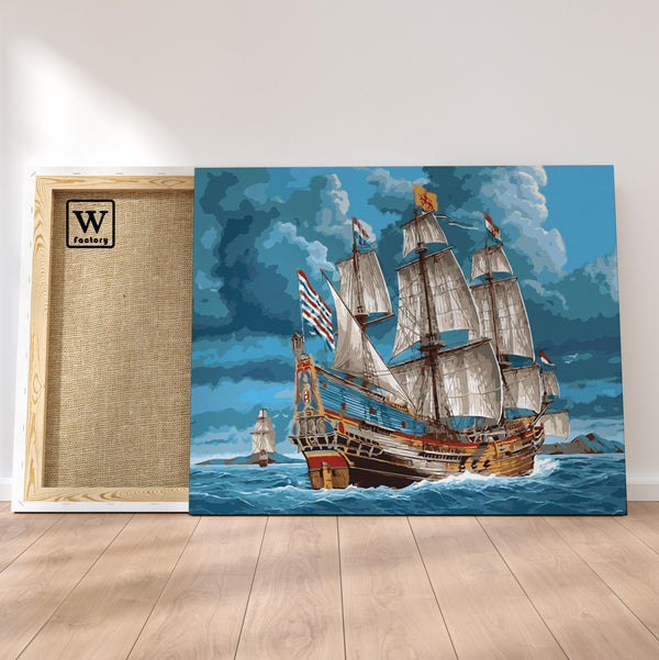 Première image de la peinture par numéro, Navire Corsaire , dans un cadre en bois sur du parquet.