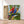 Charger l&#39;image dans la galerie, Première image de la peinture par numéro, Perroquets Inséparables , dans un cadre en bois sur du parquet.
