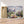 Charger l&#39;image dans la galerie, Première image de la peinture par numéro, Petite Maison Fleurie , dans un cadre en bois sur du parquet.
