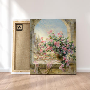 Première image de la peinture par numéro, Roses et Château , dans un cadre en bois sur du parquet.