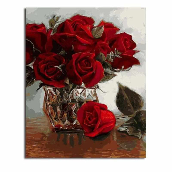 Première image de la peinture par numéro, Roses Pourpres , dans un cadre en bois sur du parquet.