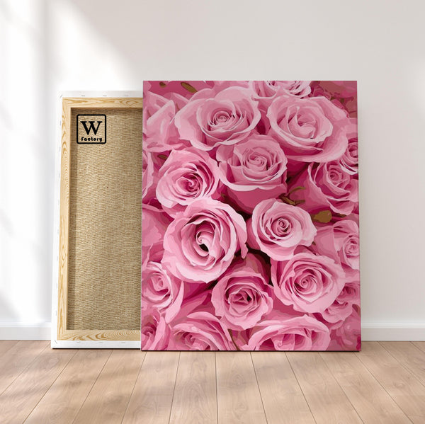 Première image de la peinture par numéro, Roses , dans un cadre en bois sur du parquet.