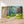 Première image de la peinture par numéro, Sentier de Campagne , dans un cadre en bois sur du parquet.