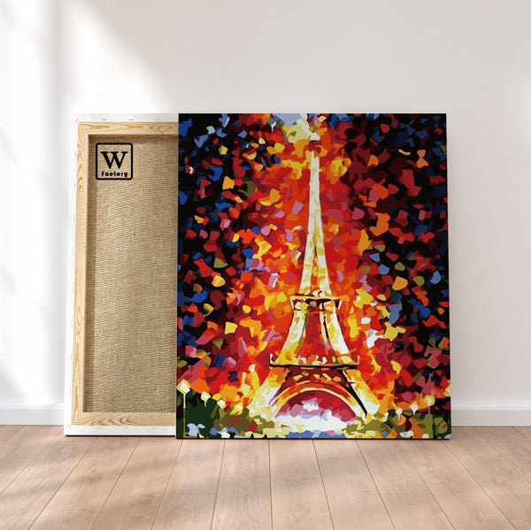 Première image de la peinture par numéro, Tour Eiffel Abstraite , dans un cadre en bois sur du parquet.