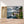 Charger l&#39;image dans la galerie, Première image de la peinture par numéro, Village au Bord du Lac , dans un cadre en bois sur du parquet.
